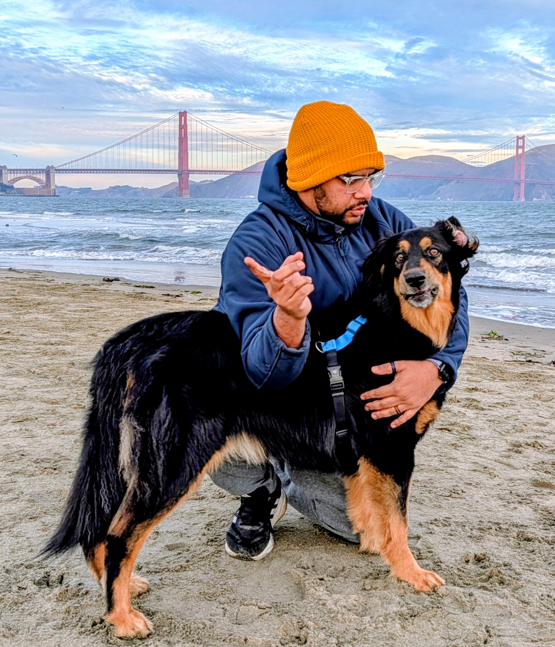 Avinash and Cova on the beach with the Golden Gate Bridge in the background